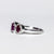 Anello in Oro Bianco 18 Kt con Rubini Laterali Color Rosso e Rubino Centrale Color Rosato Contornati di Diamanti
