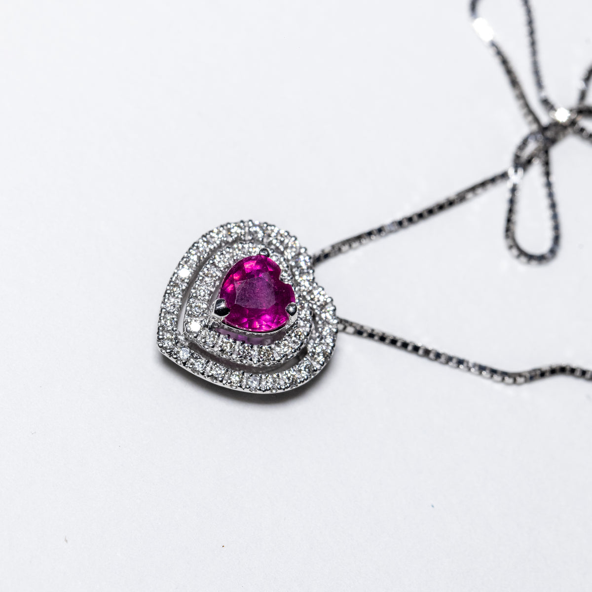 18Kt White Gold Necklace Heart Shape Pave' with Double Row of Diamonds and Central Ruby