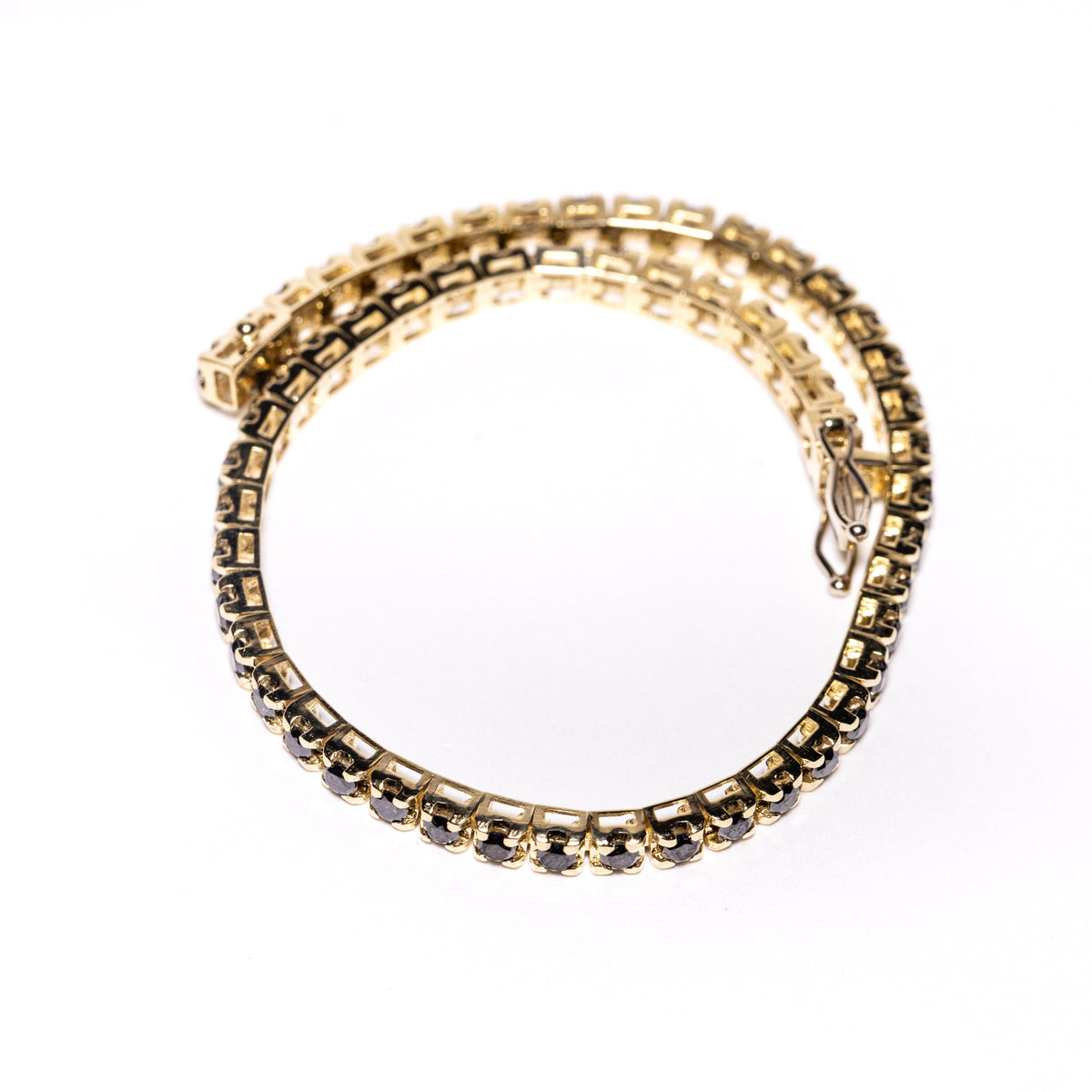 18kt yellow gold tennis bracelet with black diamonds