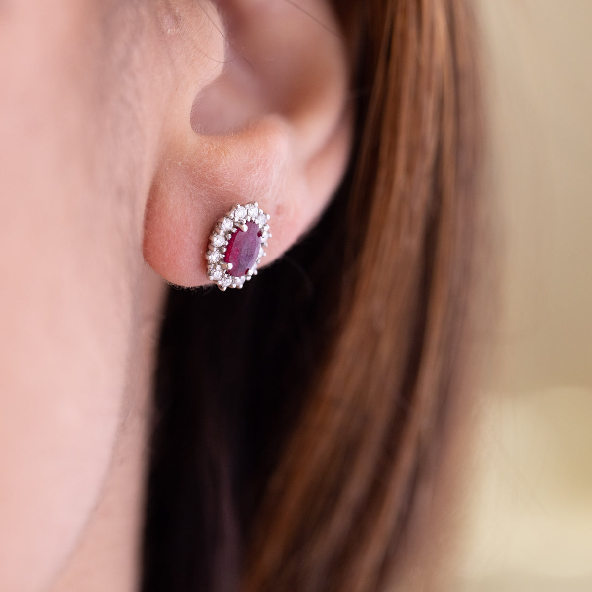 18kt white gold earrings with rubies surrounded by diamonds
