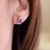 Orecchini in oro bianco 18 kt con Rubini contornato di diamanti
