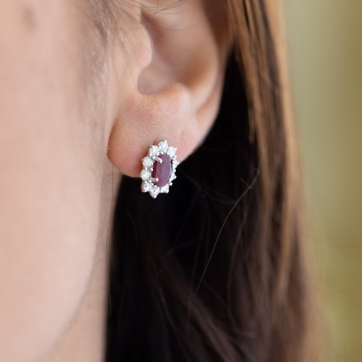 18kt white gold earrings with rubies surrounded by diamonds