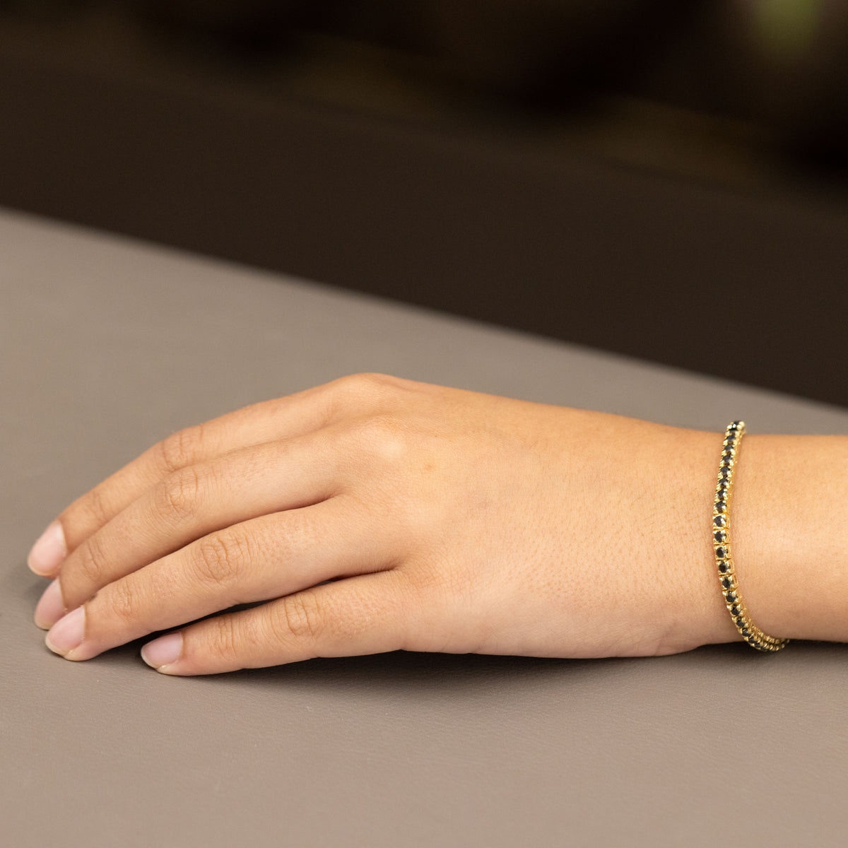 18kt yellow gold tennis bracelet with black diamonds