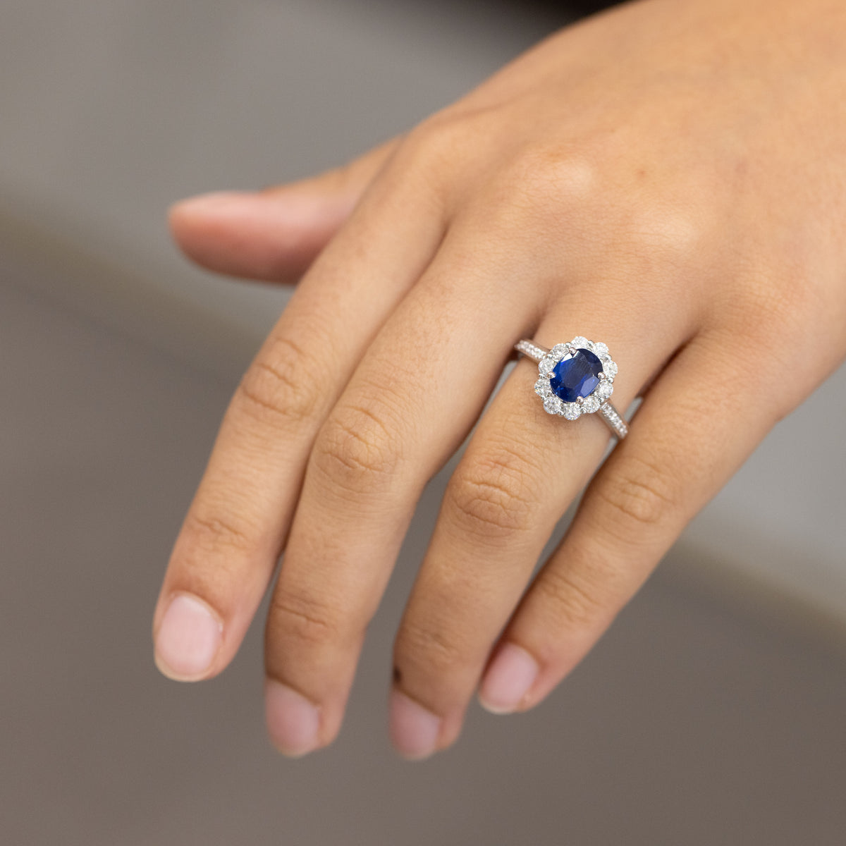 18kt white gold ring with 2.20kt sapphire and diamond surround