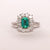 Anello in Oro Bianco 18KT con smeraldo taglio emerald e contorno in diamanti