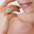 (Two Variants) 18KT White Gold Ring with Central Emerald and Double Diamond Surround