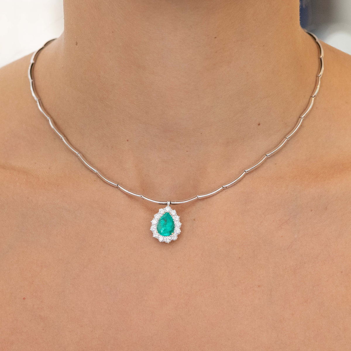 18kt White Gold Emerald Drop Pendant Necklace with Diamond Surround