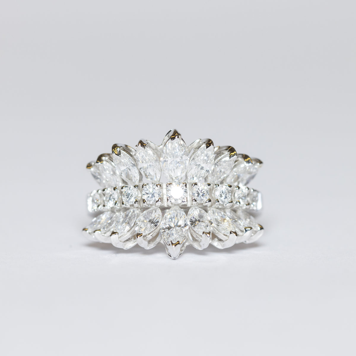 18kt White Gold Ring with Central Brilliant Cut Diamonds and Pear Cut Diamonds on the Sides