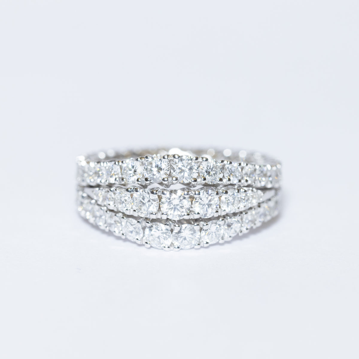 18KT White Gold Band Ring with Three Eternity Rings in Round Brilliant Cut Diamonds