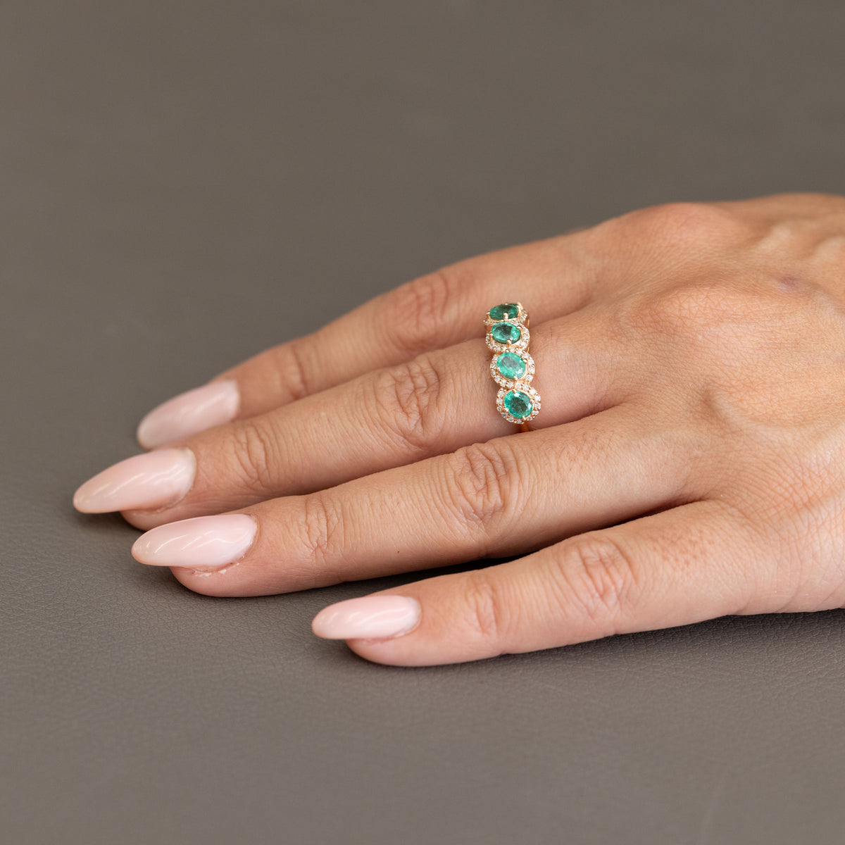 18KT Rose Gold Veretta Ring with Oval Cut Emeralds and Diamonds