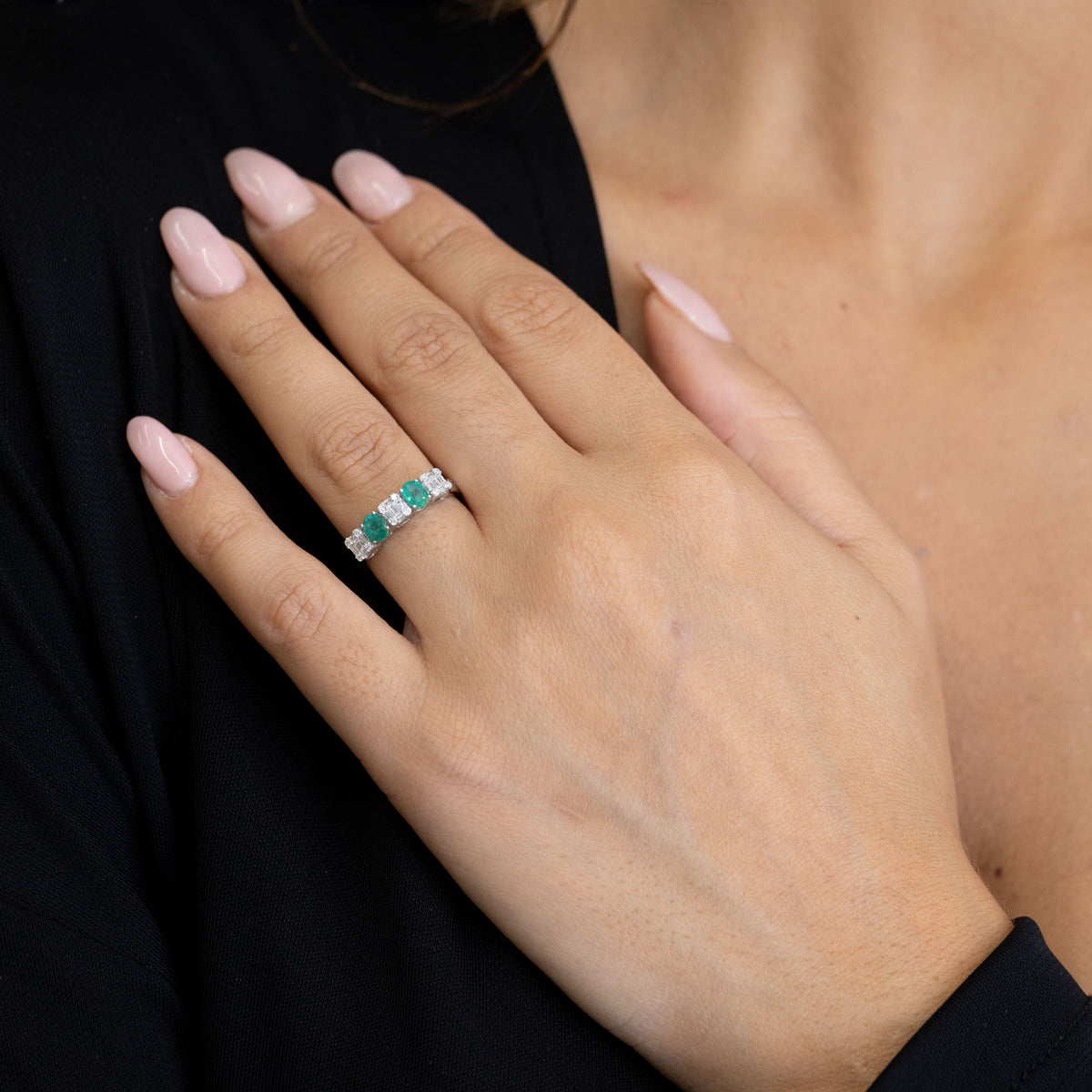 18kt White Gold Ring with Oval Cut Emeralds and Baguette Cut Diamonds