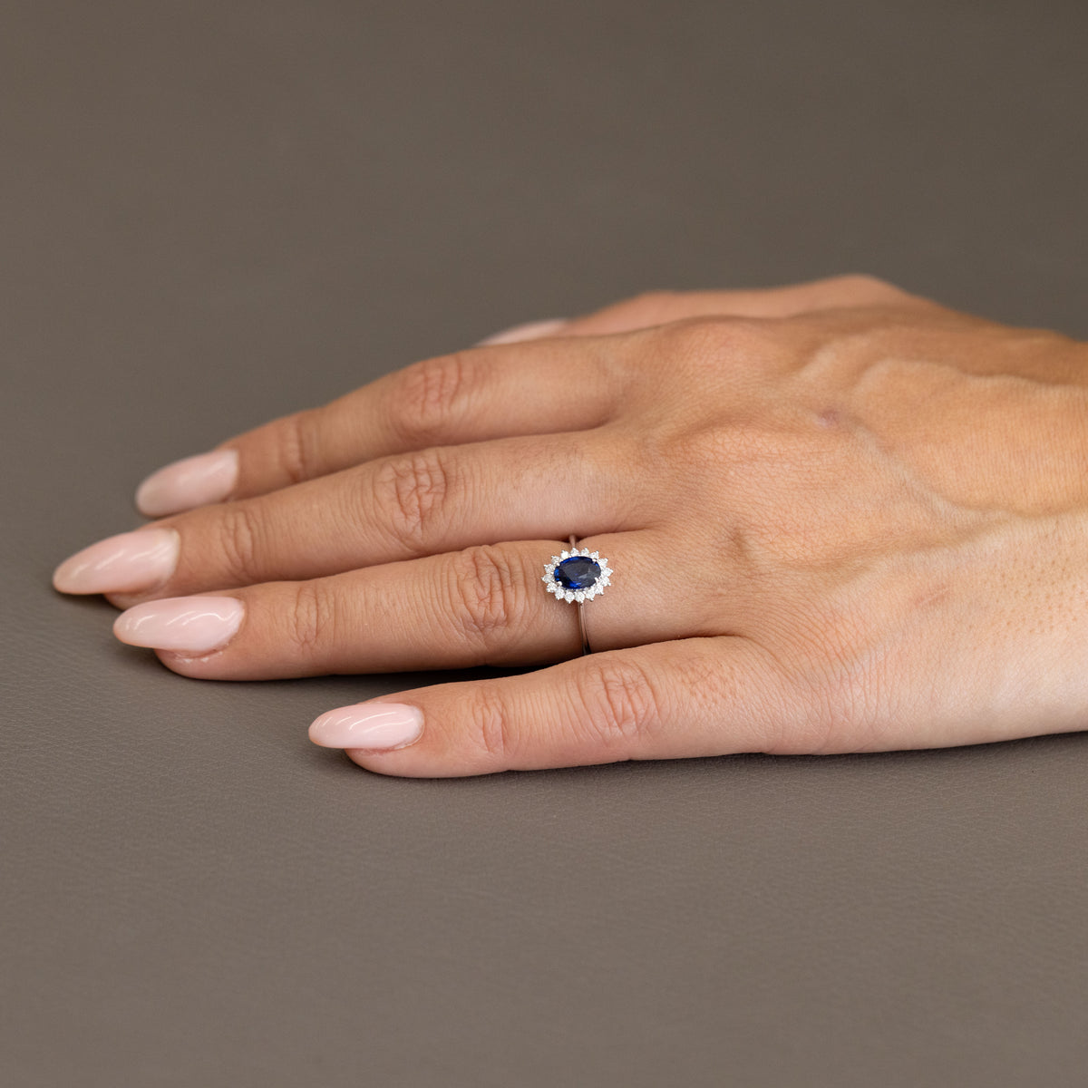 18kt White Gold Ring with Oval Sapphire and Diamond Surround