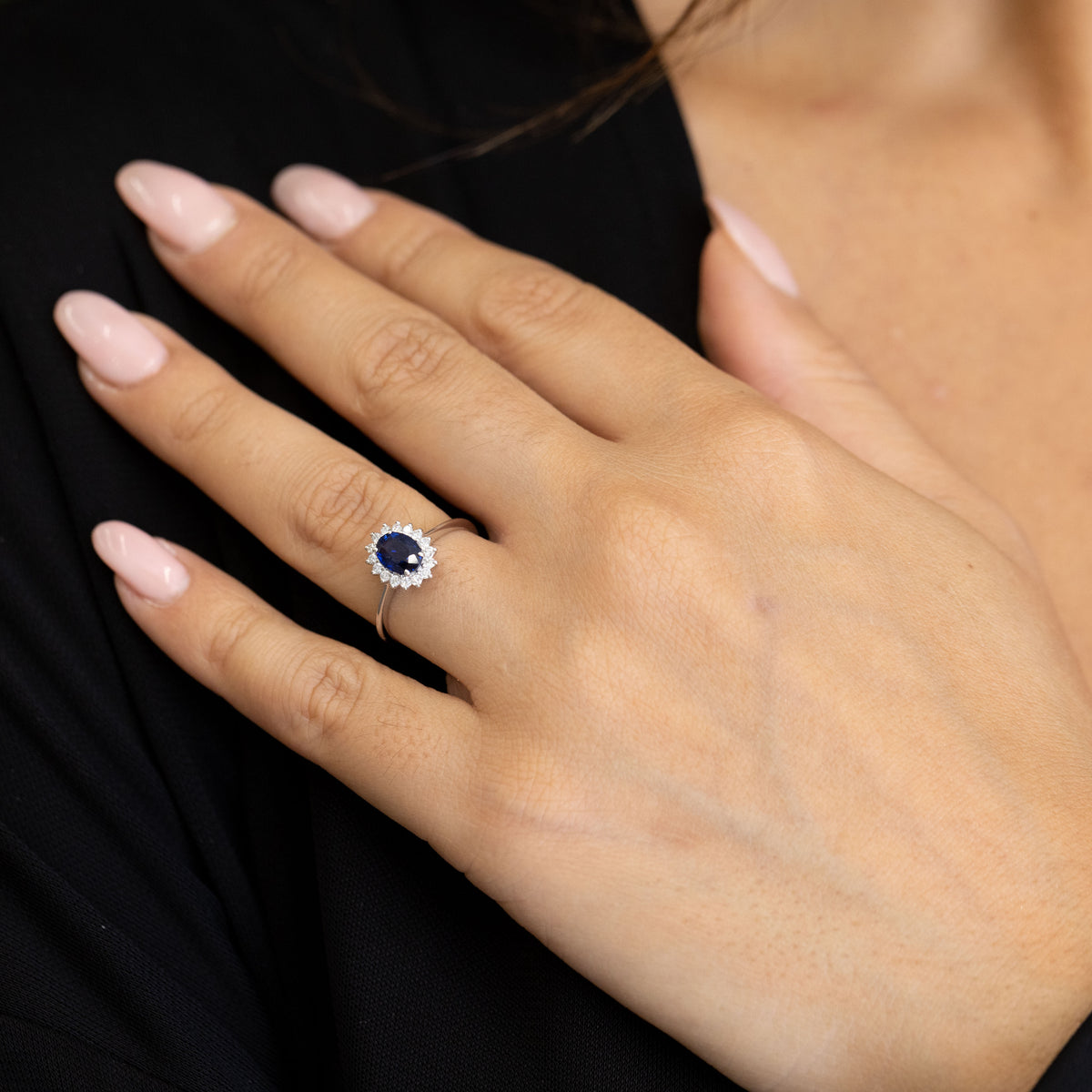 18kt White Gold Ring with Oval Sapphire and Diamond Surround