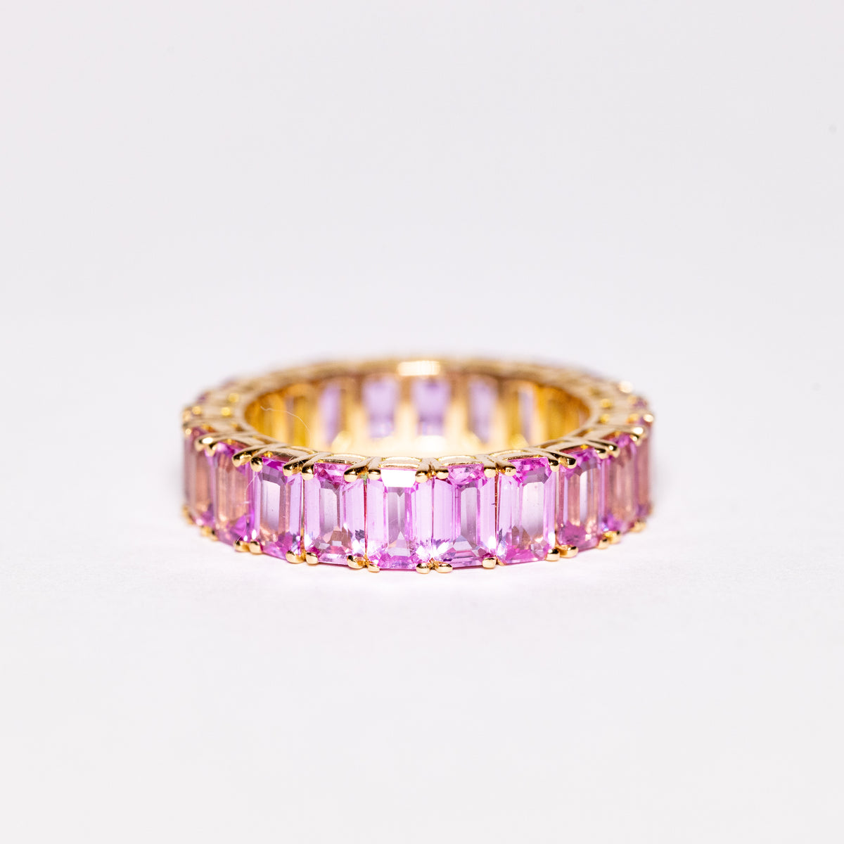 18kt Yellow Gold Eternity Ring with Baguette Cut Pink Sapphires