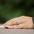 Anello trilogy di Smeraldi centrali contorno Diamanti