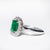 Anello in oro bianco 18kt con Smeraldo e contorno in Diamanti