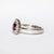 Anello in oro bianco 18kt con Rubino Ovale e contorno in Diamanti