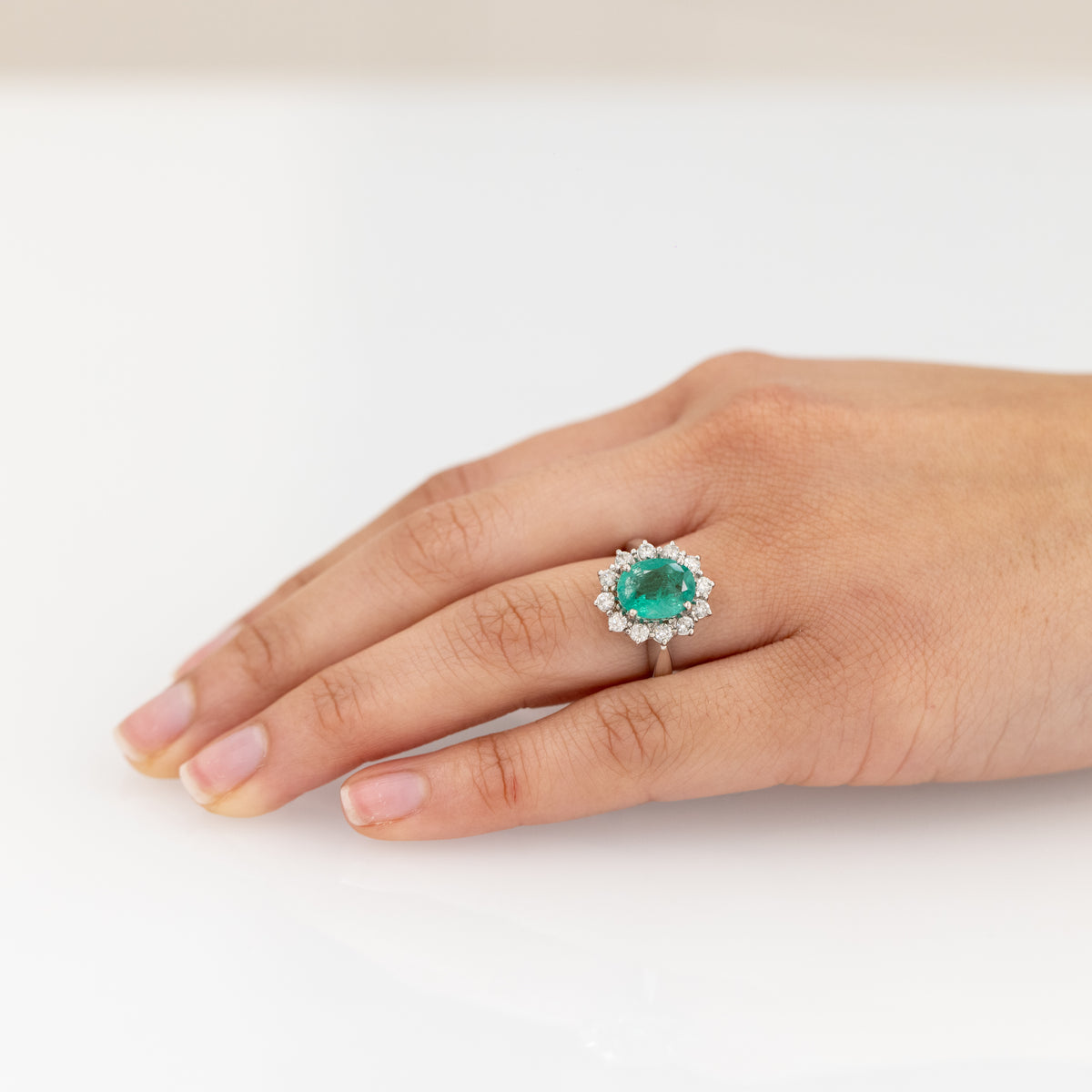 18 KT White Gold Ring With Oval Cut Central Emerald and Diamond Ring