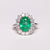 Anello in Oro Bianco 18KT con Smeraldo centrale da 3 carati e diamanti