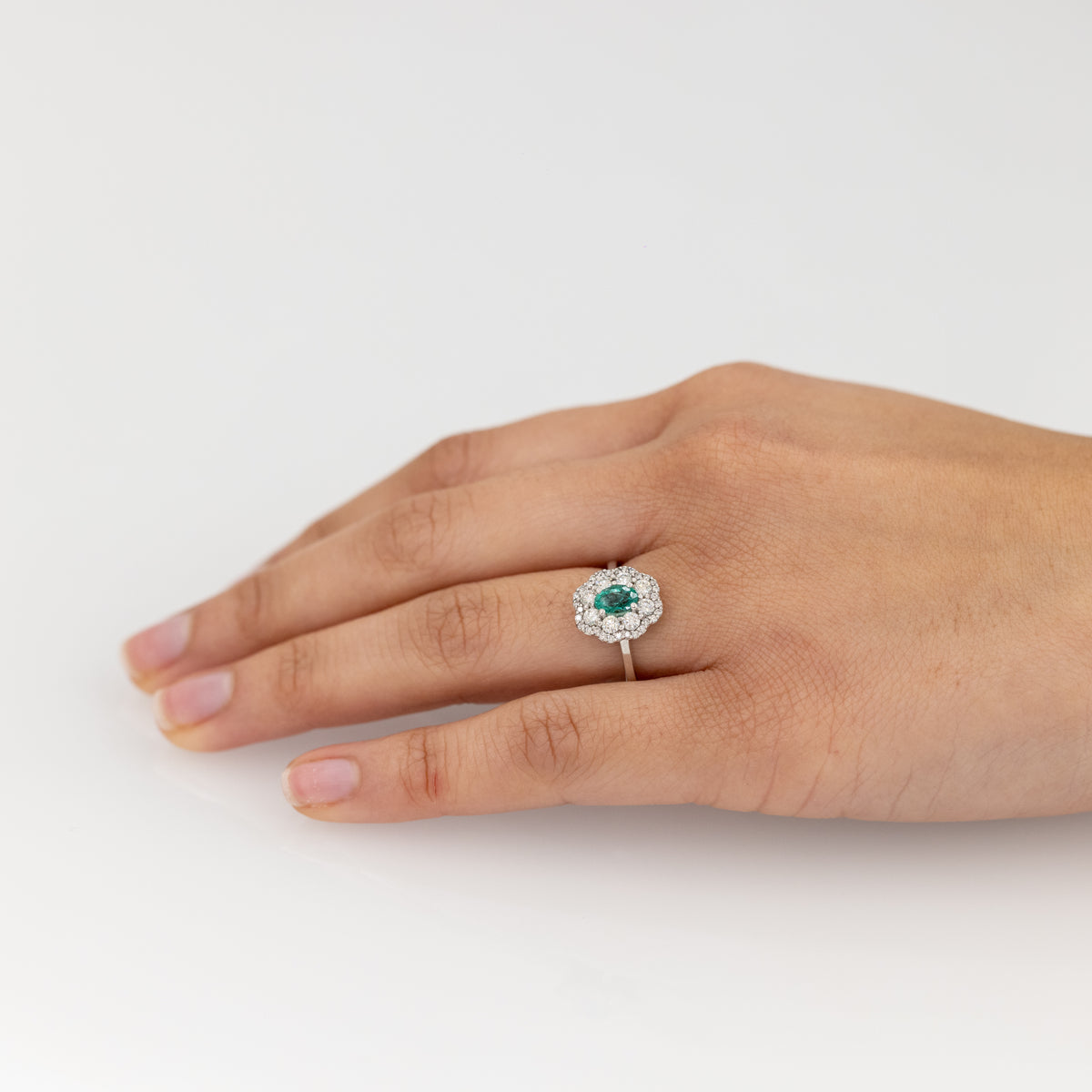 18 KT White Gold Flower Fantasy Ring With Central Emerald and Double Row of Diamonds