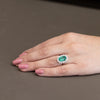 Anello in Oro Bianco 18KT con Smeraldo Centrale da 3 carati e Contorno in Diamanti