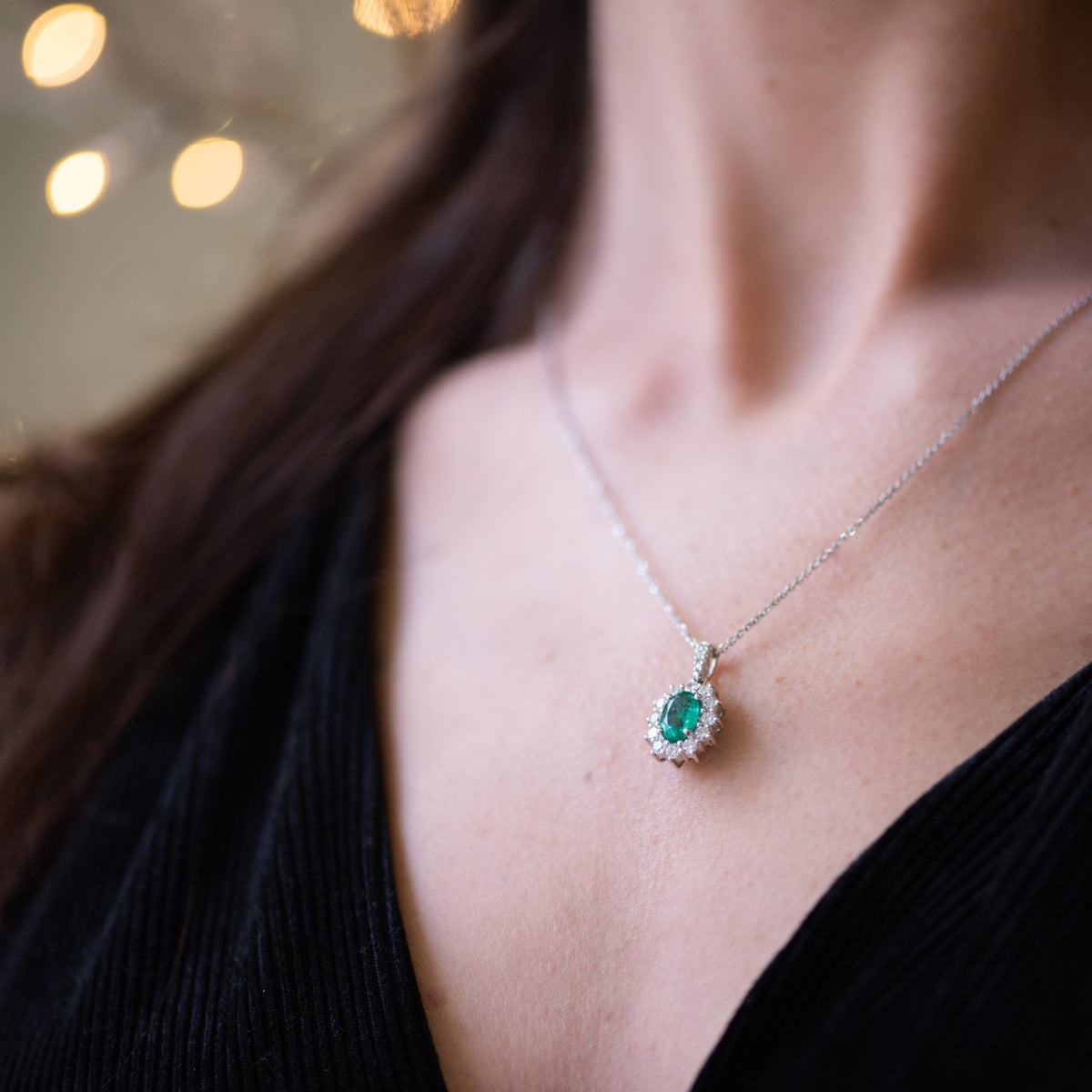 Central Emerald Pendant Surrounded by Diamonds in 18kt White Gold