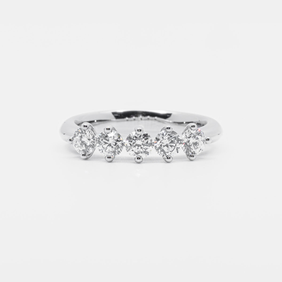 5 stone ring in Platinum and brilliant cut diamonds